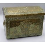 An embossed brass coal / log bin