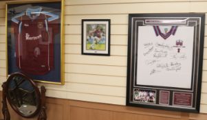 Two Westham shirts and picture of Carlos Tevez, baring signatures