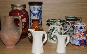 Two Oriental vases and seven jugs