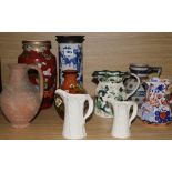 Two Oriental vases and seven jugs