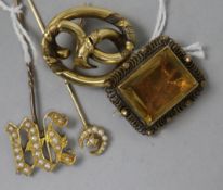 A Victorian yellow metal openwork brooch, a similar citrine brooch and two pearl set yellow metal