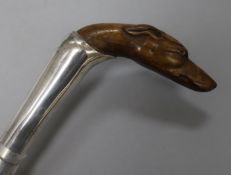 A white metal-mounted fruitwood walking stick with finely-carved whippet's head handle, L 3ft