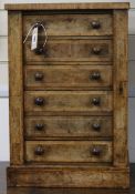 A Victorian cross-banded walnut Wellington chest of small proportions, fitted six drawers, (top a.