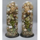 A pair of mid Victorian glass, fabric and metal foil vases of fruit and flowers, under glass dome