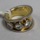 An 18ct gold three stone diamond ring