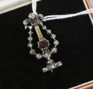 A late Victorian gold and silver, rose cut diamond and garnet set lyre brooch, in later fitted