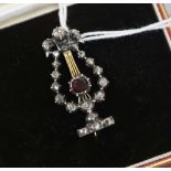 A late Victorian gold and silver, rose cut diamond and garnet set lyre brooch, in later fitted