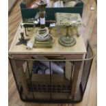 Three brass trivets, a brass stand, a fireguard and a brass Corinthian column table lamp