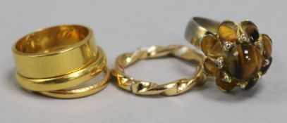 Three 22ct gold gold wedding bands and two other costume rings.