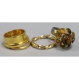 Three 22ct gold gold wedding bands and two other costume rings.