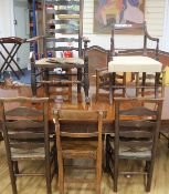 An early 19th Century elm ladderback rush-seat elbow chair, 5 similar dining chairs, a Regency