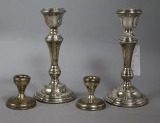 A pair of 1960's silver candlesticks and a pair of later dwarf candlesticks, tallest 20.5cm.