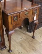 A walnut and featherbanded lowboy, in George II style H.75cm
