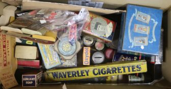 A quantity of tins and advertising signs