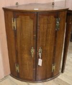 A late 18th century hanging corner cupboard, H.75cm