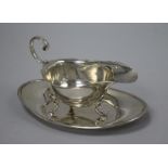 An American sterling silver sauce boat and stand, stand 14.2cm.