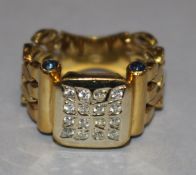 A diamond and cabochon sapphire ring, 800 standard yellow gold setting with articulated shank size