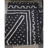 A handwoven geometric cover and a tribal printed panel