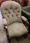 A Victorian mahogany floral button backed armchair
