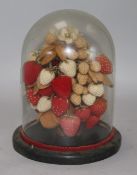 A Victorian crochet work group of strawberries and under a glass dome