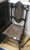 A pair of Victorian caned and japanned bedroom chairs