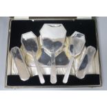 A cased Art Deco silver five piece dressing table set by Deakin & Francis Ltd, Birmingham, 1934/5.