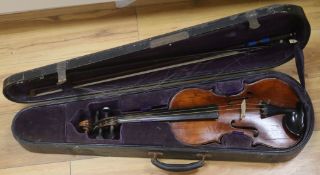 A cased violin and bows