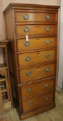 A 19th century oak narrow chest style linen press, H.167cm