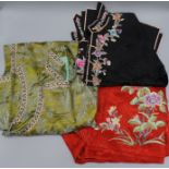 A Chinese embroidered jacket and skirt and silk dress