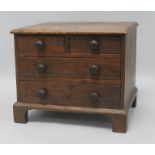 An oak miniature chest of drawers