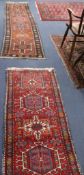 Two Persian red ground runners, 250 x 69cm & 170 x 66cm