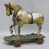 A Victorian painted carved wood pull-along horse