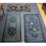 Three Chinese blue ground mats, 120 x 65cm, 120 x 57cm & 110 x 60cm