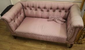 An upholstered two seat drop end sofa, W.145cm