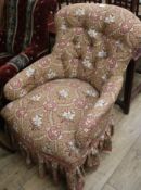 A Victorian mahogany button back spoon back easy armchair