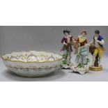 Three figurines and a large bowl
