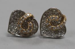 A pair of 18ct white and yellow gold diamond-set heart-shaped earrings (one butterfly missing).