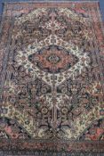A Persian blue and pink ground medallion rug 190 x 130cm