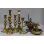 A collection of brass candlesticks and Austrian figurative table striker etc