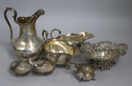 A Victorian engraved silver cream jug, two silver sauceboats, a pierced silver bonbon dish, two