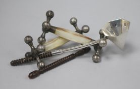 A pair of 1920's silver and mother of pearl mounted knife rests and a modern silver candle