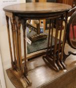 A nest of three mahogany oval topped tea tables, H.67cm
