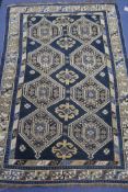A Caucasian blue ground rug, 170 by 110cm