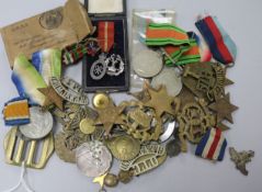 A quantity of assorted of medals and badges.