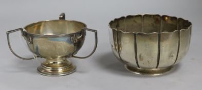 A Victorian fluted silver bowl and a later silver tri-handled small cup, 6 oz.
