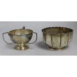 A Victorian fluted silver bowl and a later silver tri-handled small cup, 6 oz.