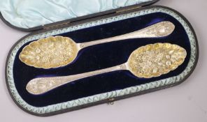 A cased pair of Victorian 'berry' spoons, Walker & Hall, Sheffield, 1888, 5.5 oz.