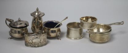 A 1970's silver three piece condiment set, a silver tea strainer and stand, and three silver