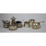 A 1970's silver three piece condiment set, a silver tea strainer and stand, and three silver