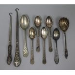 Two silver handled button hooks, a sterling silver teaspoon, a silver preserve spoon and five plated